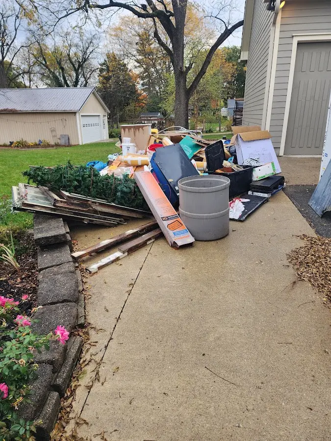 Dumpster being loaded with debris for 10 Yard Dumpster Rental in Augusta